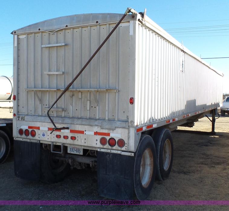 image for item J1278 1983 Chamberlin JAGH-700 double hopper grain trailer