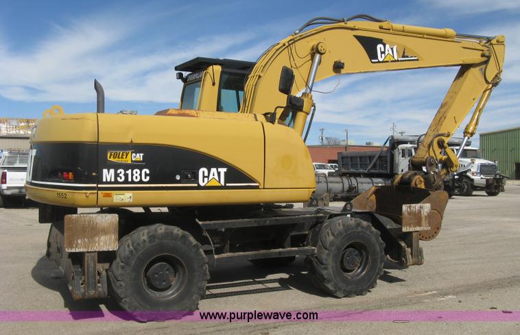 image for item J2903 Caterpillar M318C rubber tire excavator