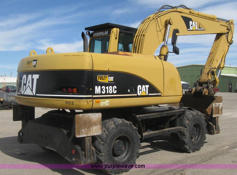 image for item J2903 Caterpillar M318C rubber tire excavator
