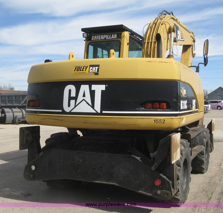 image for item J2903 Caterpillar M318C rubber tire excavator