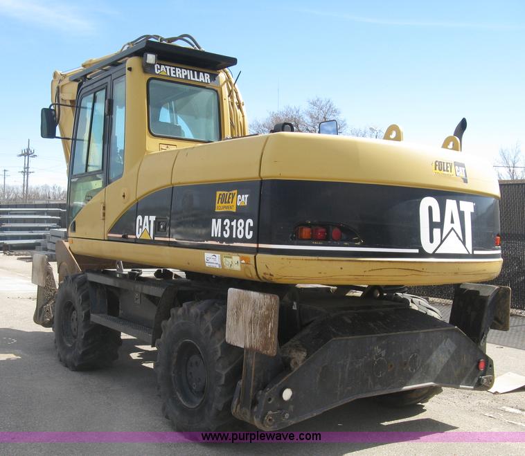 image for item J2903 Caterpillar M318C rubber tire excavator