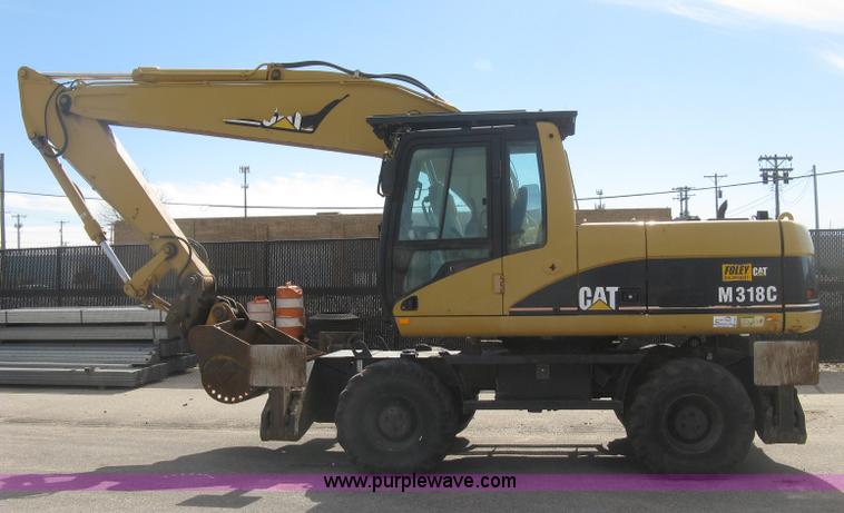 image for item J2903 Caterpillar M318C rubber tire excavator