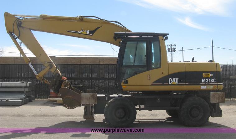 image for item J2903 Caterpillar M318C rubber tire excavator