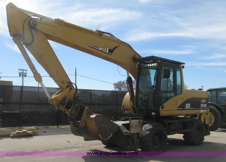 image for item J2903 Caterpillar M318C rubber tire excavator