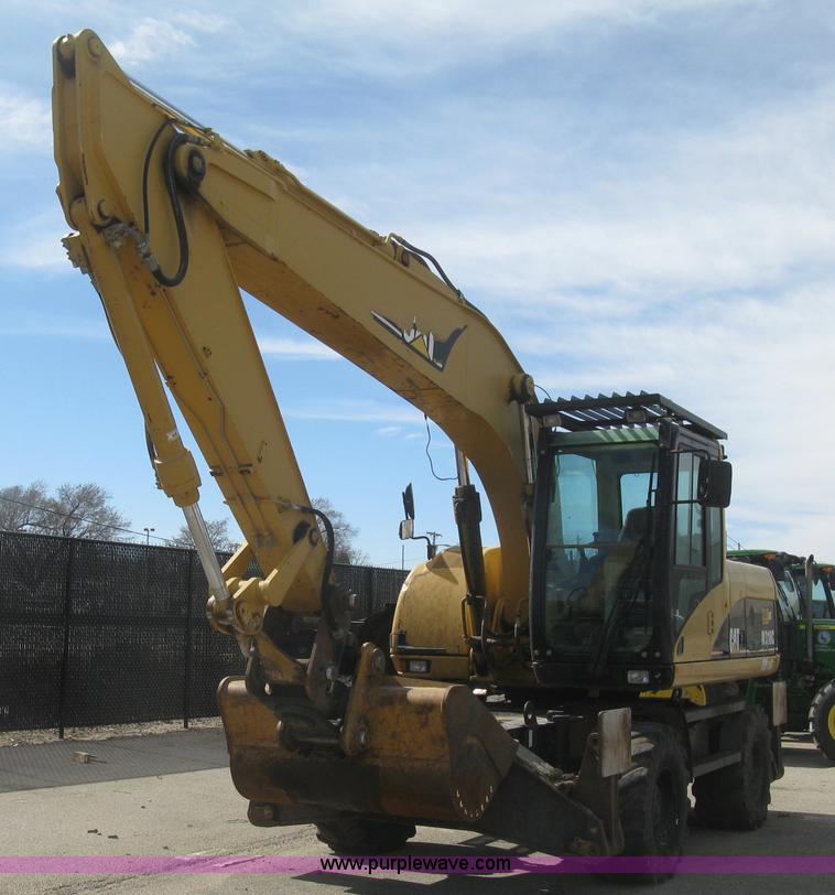 image for item J2903 Caterpillar M318C rubber tire excavator