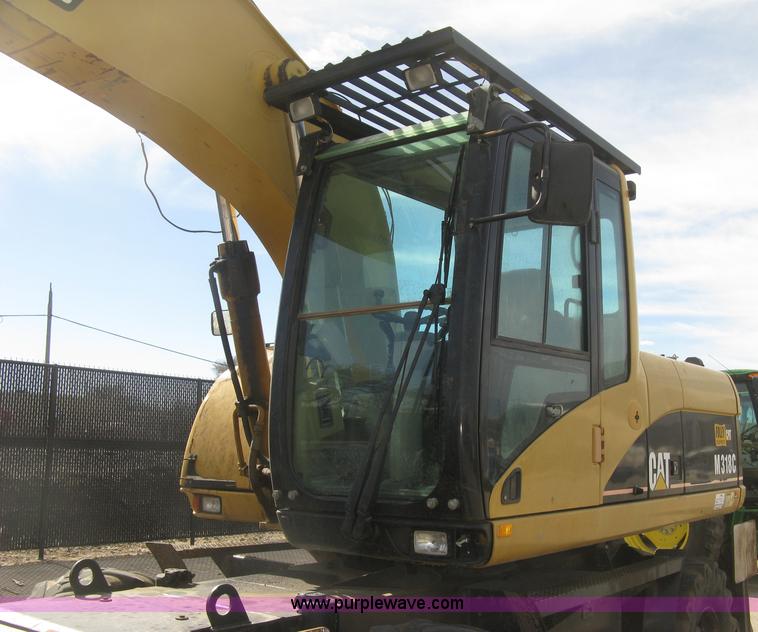 image for item J2903 Caterpillar M318C rubber tire excavator