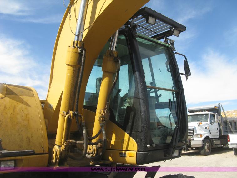 image for item J2903 Caterpillar M318C rubber tire excavator