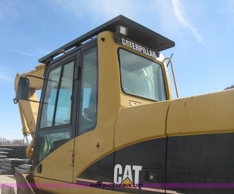 image for item J2903 Caterpillar M318C rubber tire excavator