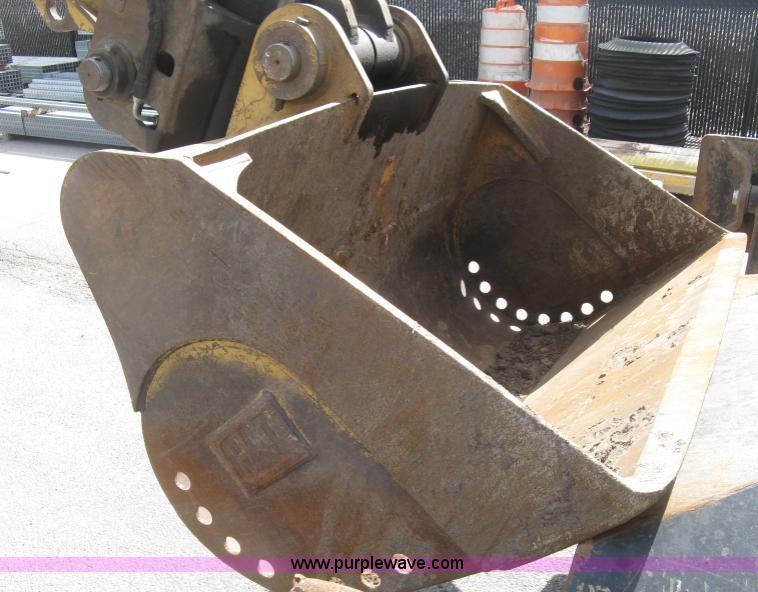 image for item J2903 Caterpillar M318C rubber tire excavator