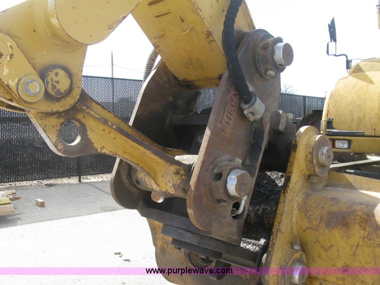 image for item J2903 Caterpillar M318C rubber tire excavator