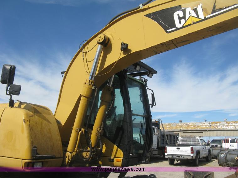 image for item J2903 Caterpillar M318C rubber tire excavator