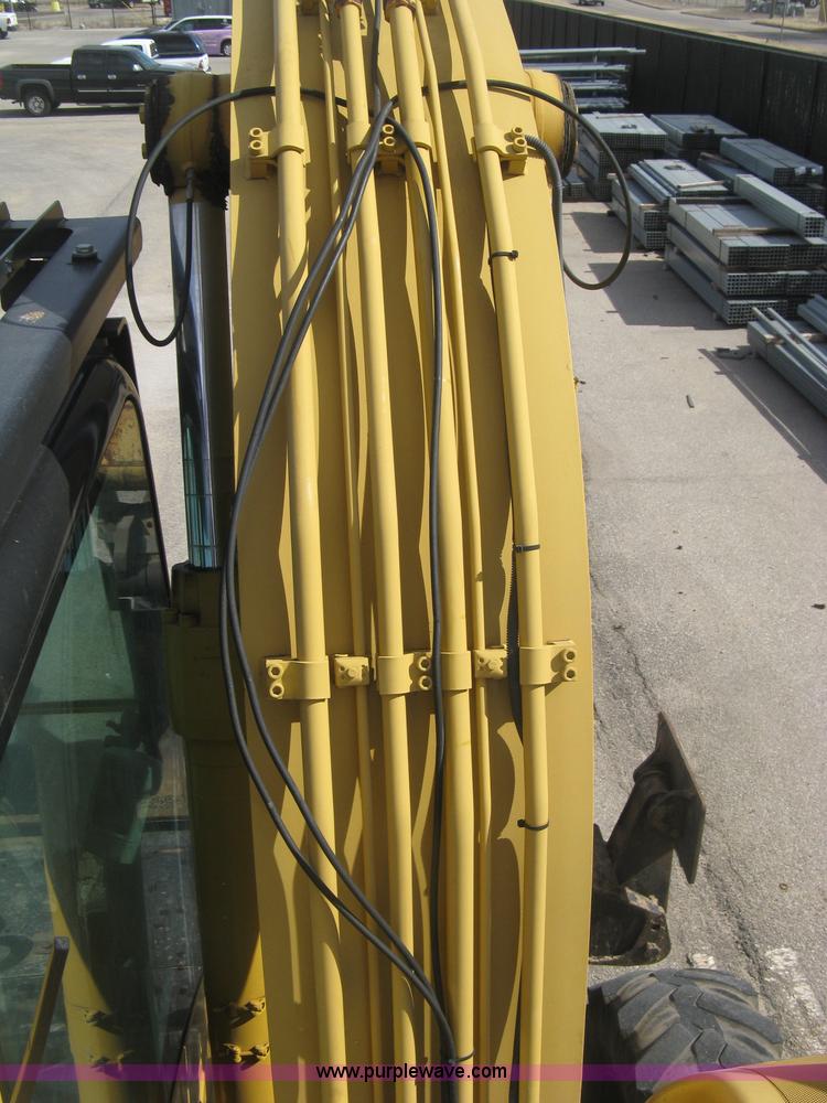 image for item J2903 Caterpillar M318C rubber tire excavator