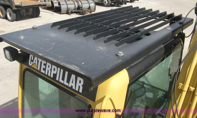 image for item J2903 Caterpillar M318C rubber tire excavator