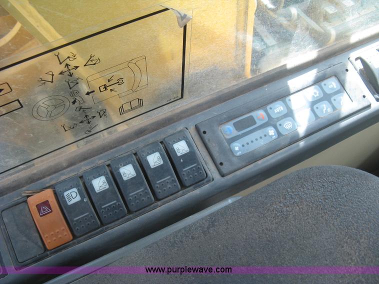 image for item J2903 Caterpillar M318C rubber tire excavator