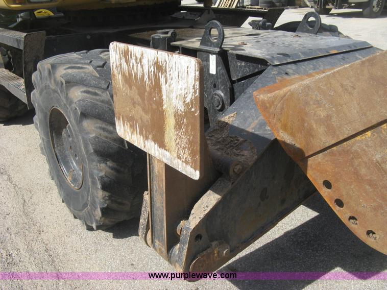 image for item J2903 Caterpillar M318C rubber tire excavator