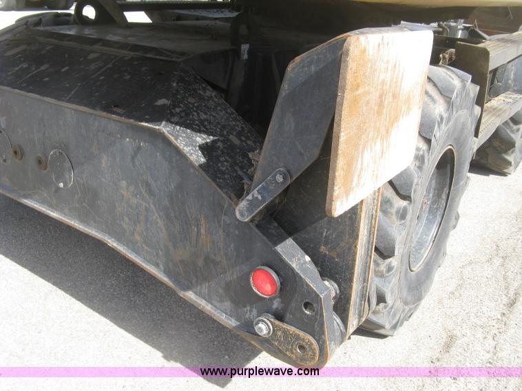 image for item J2903 Caterpillar M318C rubber tire excavator