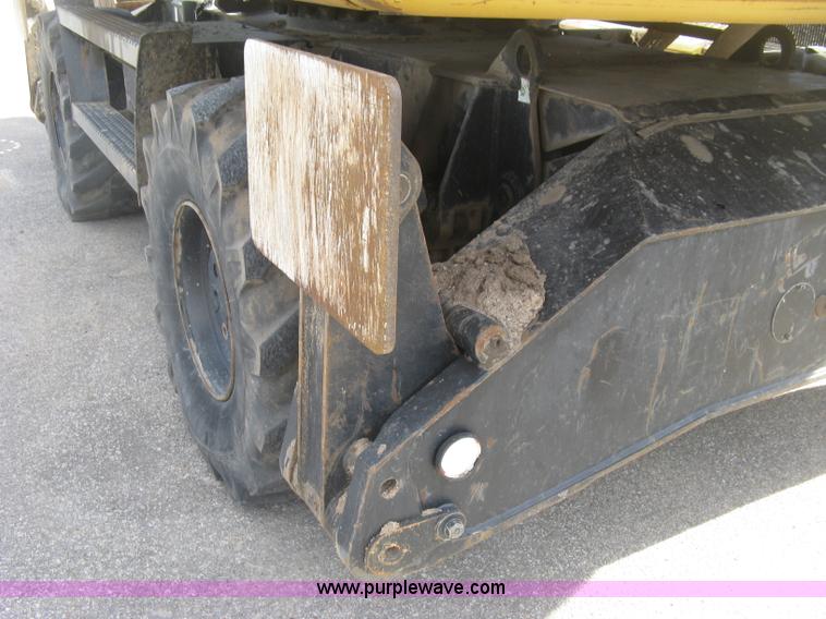 image for item J2903 Caterpillar M318C rubber tire excavator