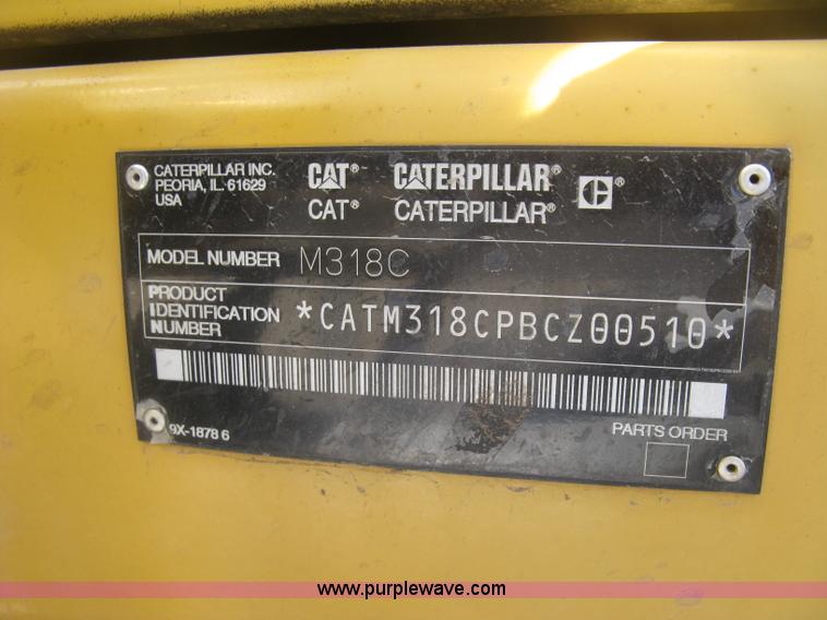 image for item J2903 Caterpillar M318C rubber tire excavator