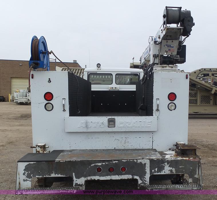 image for item K1293 1999 Freightliner FL70 service truck with crane