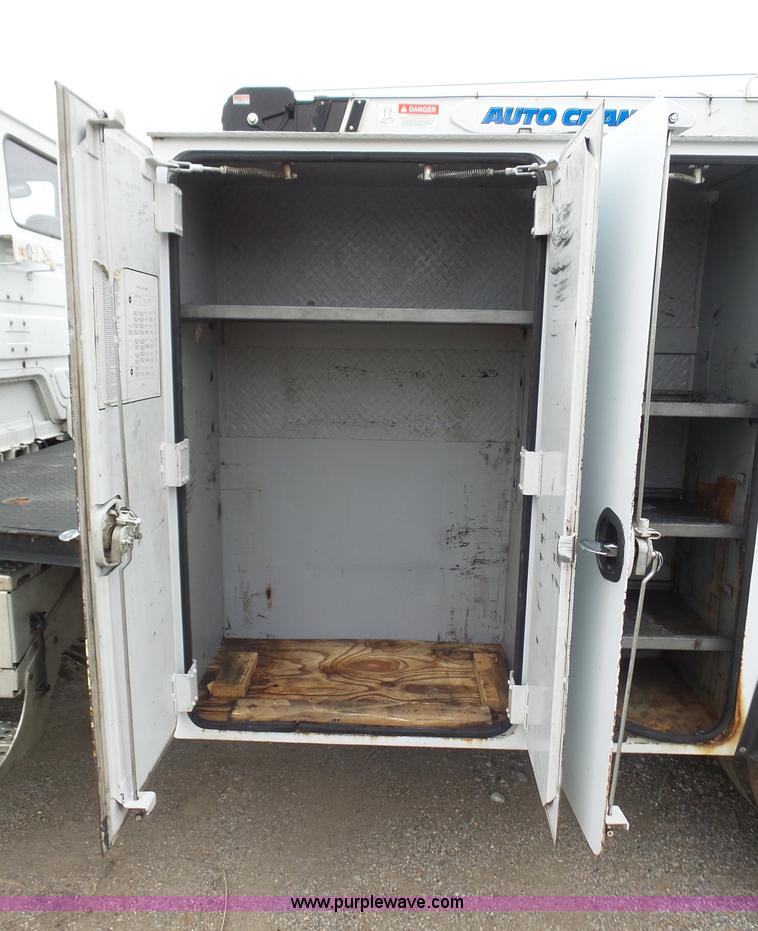 image for item K1293 1999 Freightliner FL70 service truck with crane