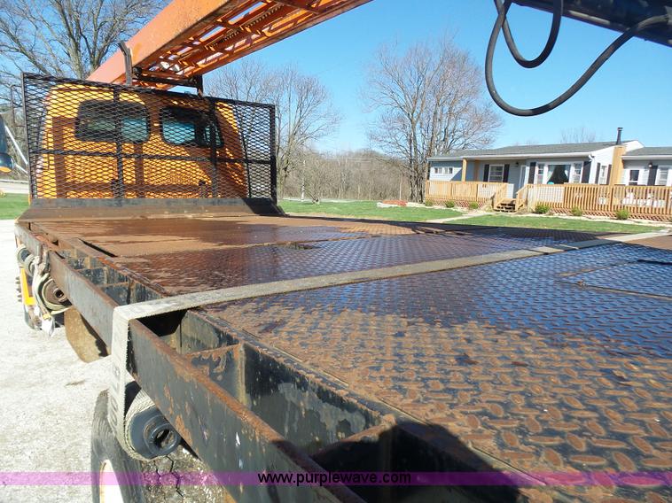 image for item K1311 1998 Ford L8501 Louisville 101 flatbed truck