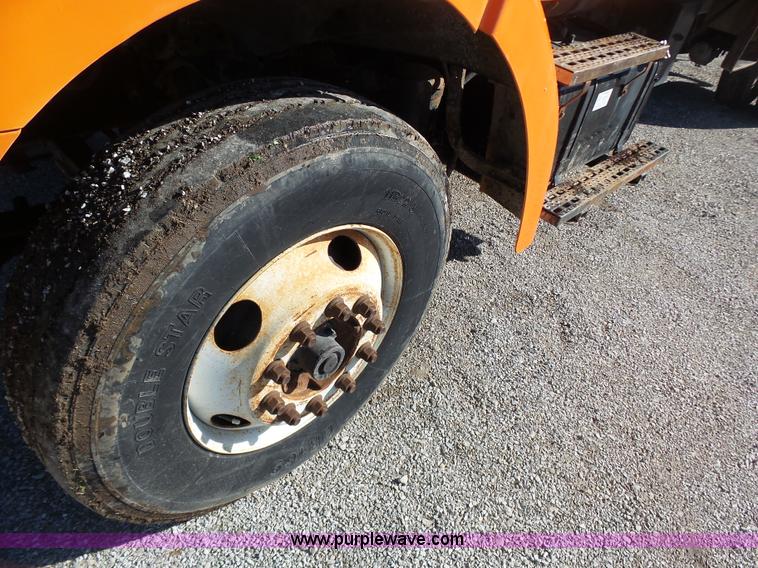 image for item K1311 1998 Ford L8501 Louisville 101 flatbed truck