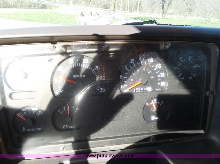 image for item K1311 1998 Ford L8501 Louisville 101 flatbed truck