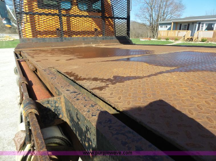 image for item K1311 1998 Ford L8501 Louisville 101 flatbed truck