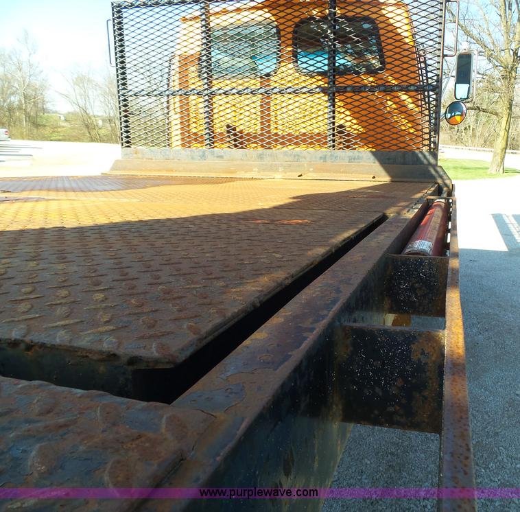 image for item K1311 1998 Ford L8501 Louisville 101 flatbed truck