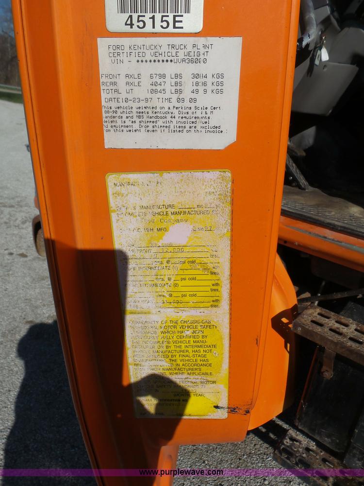 image for item K1311 1998 Ford L8501 Louisville 101 flatbed truck