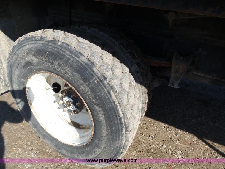 image for item K1312 1998 Freightliner FL70 flatbed truck