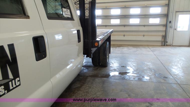 image for item K3493 2007 Ford F550 Super Duty Crew Cab flatbed truck