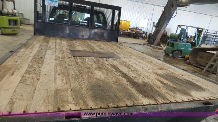 image for item K3493 2007 Ford F550 Super Duty Crew Cab flatbed truck