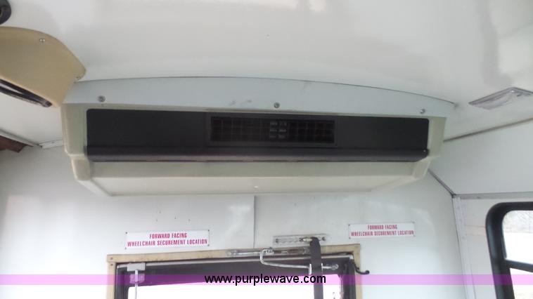 image for item J4702 2000 Ford 800 Champion bus