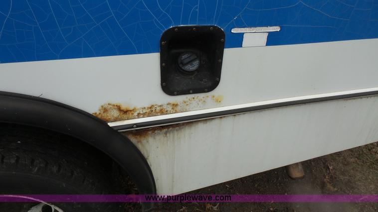 image for item J4702 2000 Ford 800 Champion bus