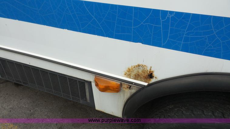 image for item J4702 2000 Ford 800 Champion bus