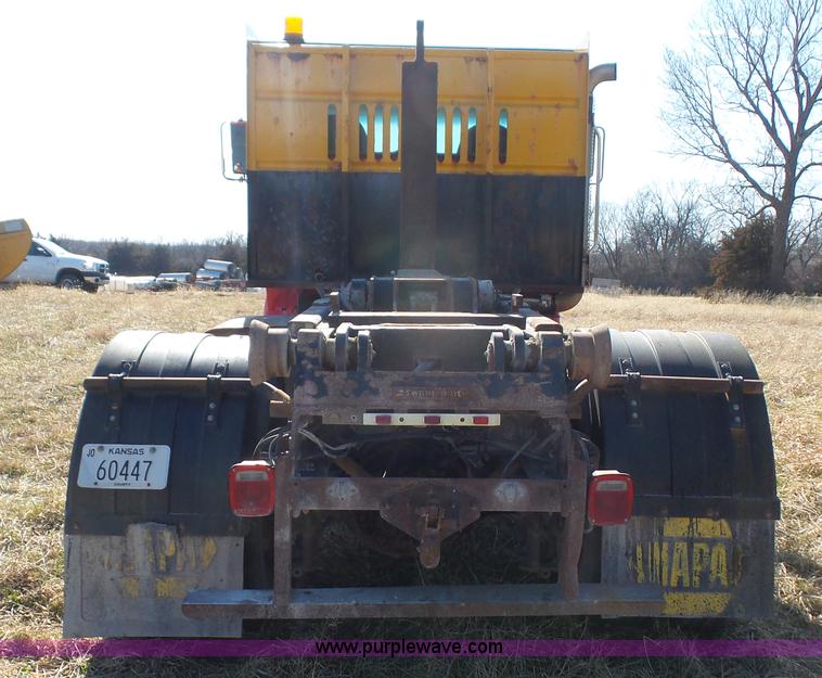 image for item L3693 2004 Sterling Acterra roll off container truck