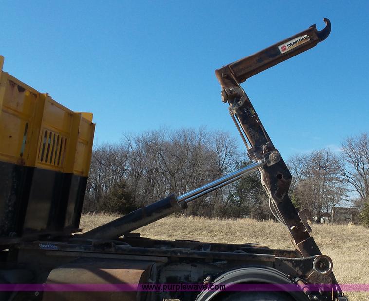 image for item L3693 2004 Sterling Acterra roll off container truck