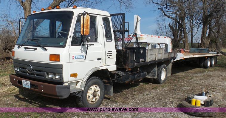 image for item BH9371 1992 Nissan truck and Landoll trailer