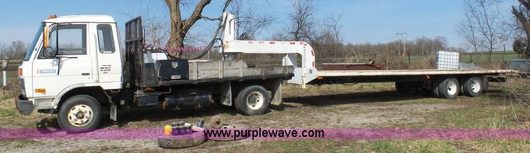 image for item BH9371 1992 Nissan truck and Landoll trailer