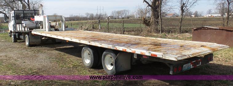 image for item BH9371 1992 Nissan truck and Landoll trailer