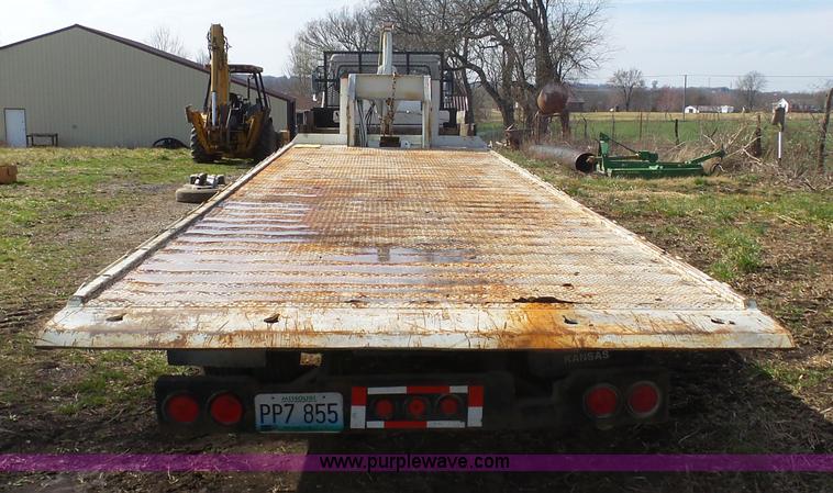 image for item BH9371 1992 Nissan truck and Landoll trailer