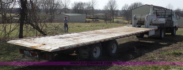 image for item BH9371 1992 Nissan truck and Landoll trailer