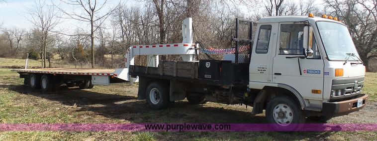 image for item BH9371 1992 Nissan truck and Landoll trailer