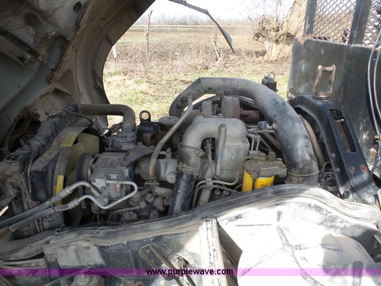 image for item BH9371 1992 Nissan truck and Landoll trailer