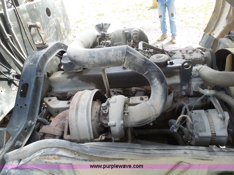 image for item BH9371 1992 Nissan truck and Landoll trailer