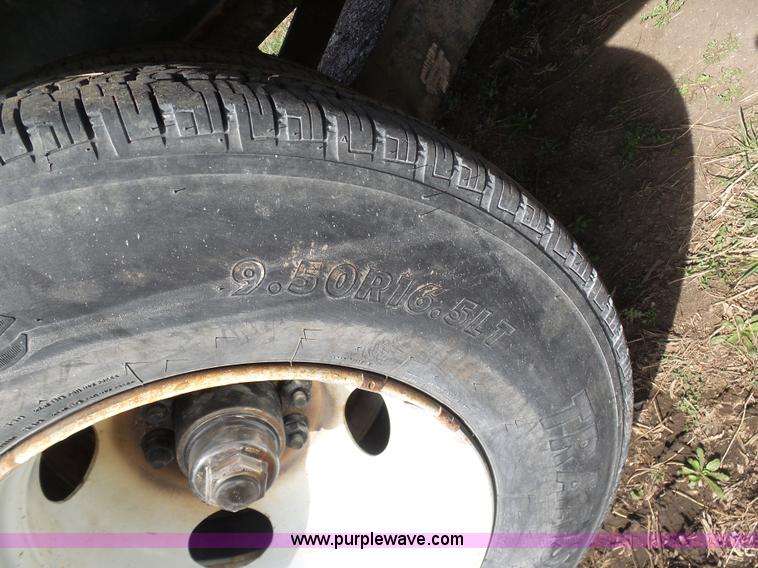 image for item BH9371 1992 Nissan truck and Landoll trailer