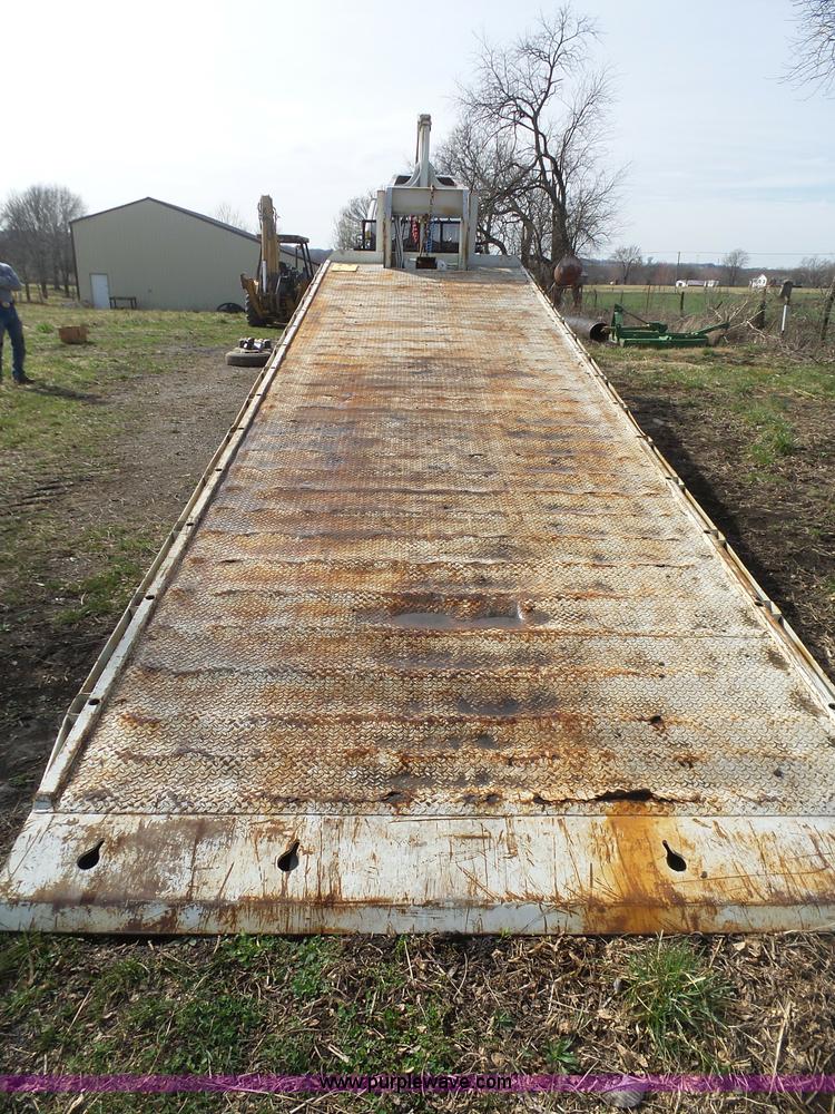 image for item BH9371 1992 Nissan truck and Landoll trailer