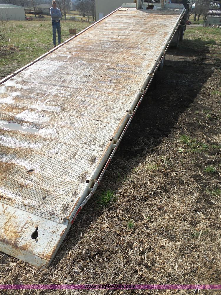 image for item BH9371 1992 Nissan truck and Landoll trailer