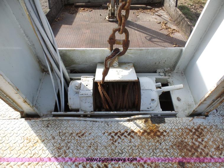 image for item BH9371 1992 Nissan truck and Landoll trailer